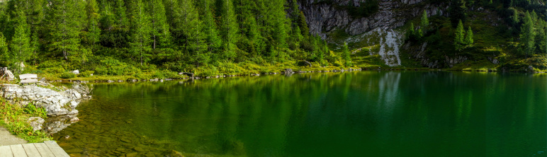 Green idyllic romantic mountain lake in Austria