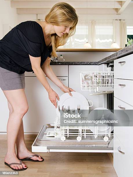 Female Emptying The Dishwasher Stock Photo - Download Image Now - Dishwasher, One Woman Only, Women