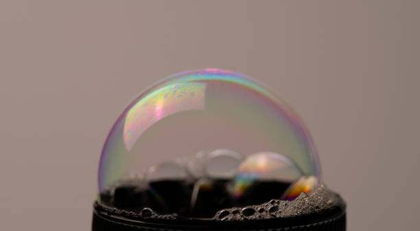 istock Bubbles forming in liquid showing unique patterns and designs caused by surface tension and thickness of liquids 1856143789