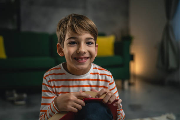 istock One caucasian boy child at home read a book education concept 1856168547