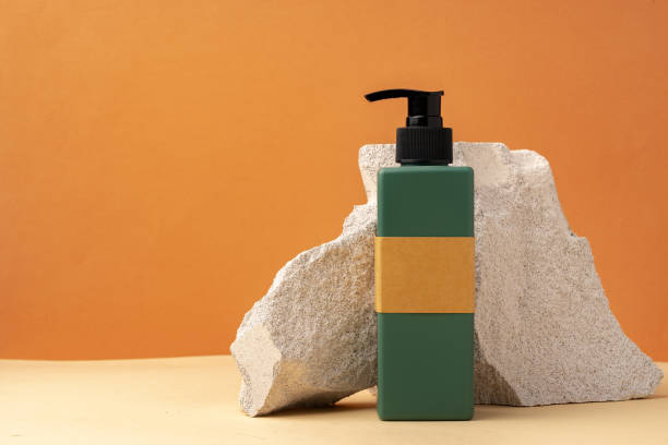 istock Cosmetic jar and stone on brown background 1856172341