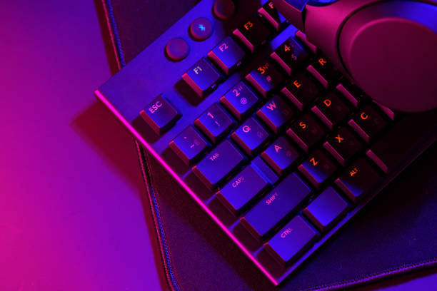 istock Headphones on a computer keyboard on black background 1856172898