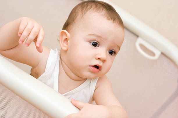 istock Cute caucasian baby in manege 185618099