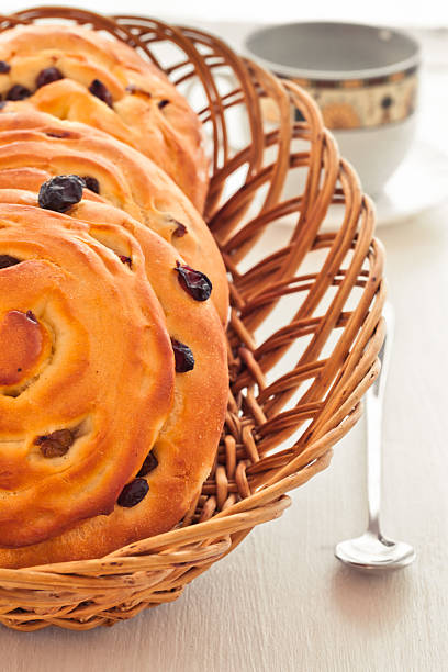 buns with raisins and a cup of tea stock photo