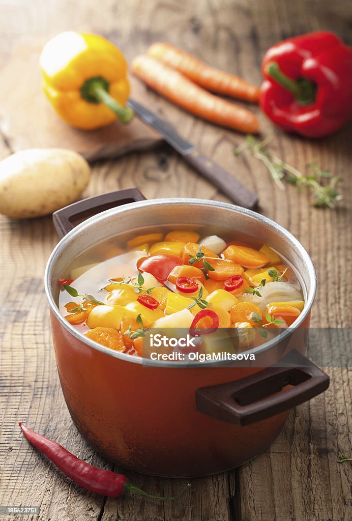 vegetable soup in red pot Carrot Stock Photo