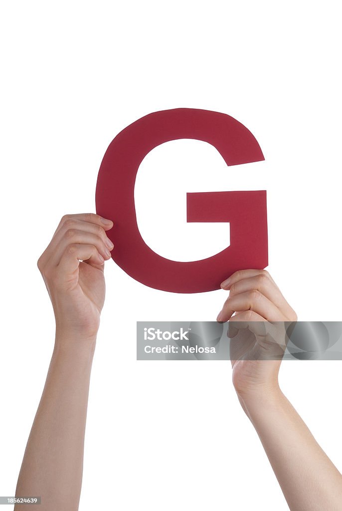 Mani tenendo G - Foto stock royalty-free di Alfabeto
