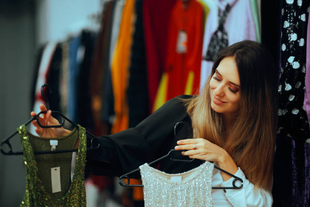 Happy Woman Comparing Two Sequins Party Tops in a Store