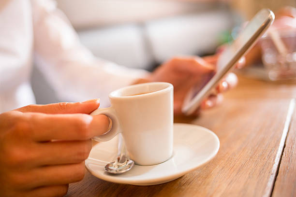 istock Woman using her cell phone in restaurant, bar 185631256