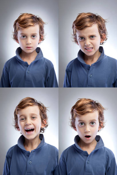 There is four photographs of cute little boys facial expressions. High resolution image.