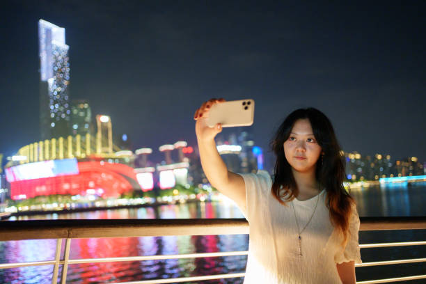 istock Young woman taking selfie with smartphone 1856357052