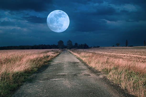 istock Moonrise over asphalt road 185636414