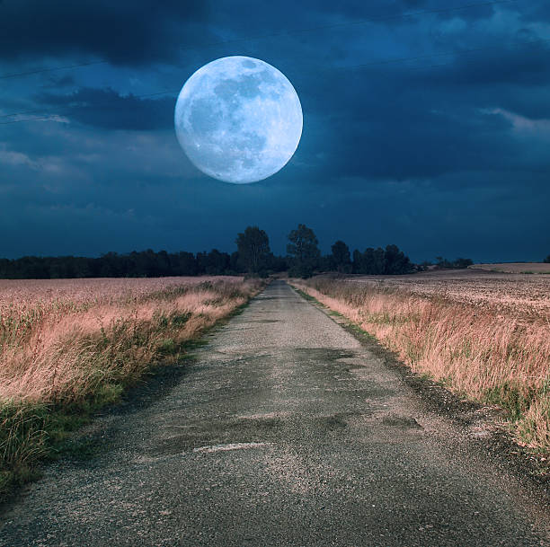 istock Moonrise over asphalt road 185636781