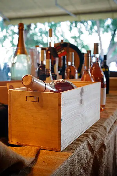 Wooden box for wine bottles and wine.