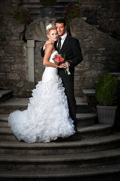 istock Bride and groom on ancient stairs 185638003