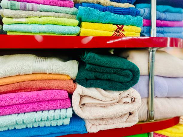istock Towels on racks in a cloth market multicolour towels 1856383379