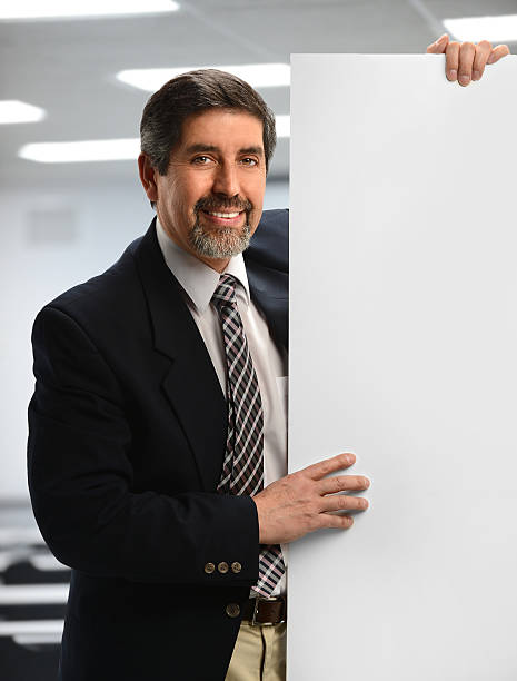 istock Businessman Holding Sign 185640854