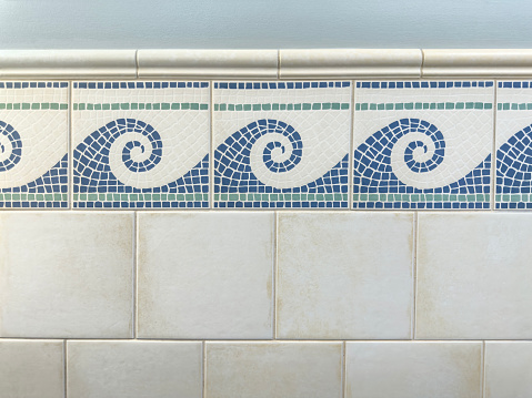 Full frame shot of a tiled wall with wave pattern