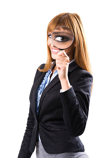 istock Businesswoman looking through magnifying glass 185643204