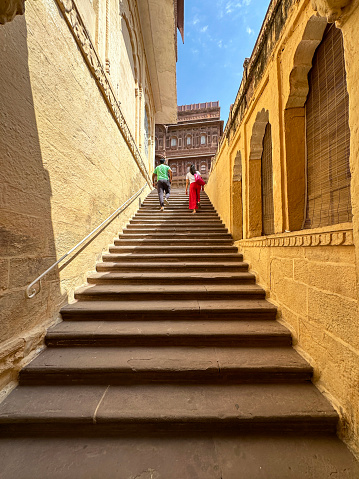 Jodhpur, Rajasthan, India - April, 11 2023: Stock photo showing tourists walking around Jodhpur's Mehrangarh Fort an UNESCO World Heritage Site.