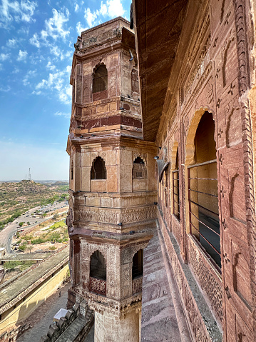 Jodhpur, Rajasthan, India - April, 11 2023: Stock photo showing view of the exterior walls of Jodhpur's Mehrangarh Fort an UNESCO World Heritage Site and the surrounding landscape.