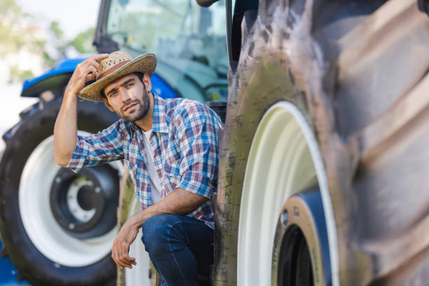 istock Farmer sitting with tractor and looking for something 1856461143