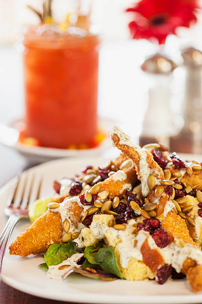 istock fried chicken salad and a bloody Mary cocktail 185646566