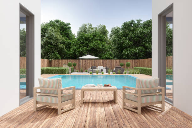 Villa Patio With Armchairs And Coffee Table By Swimming Pool