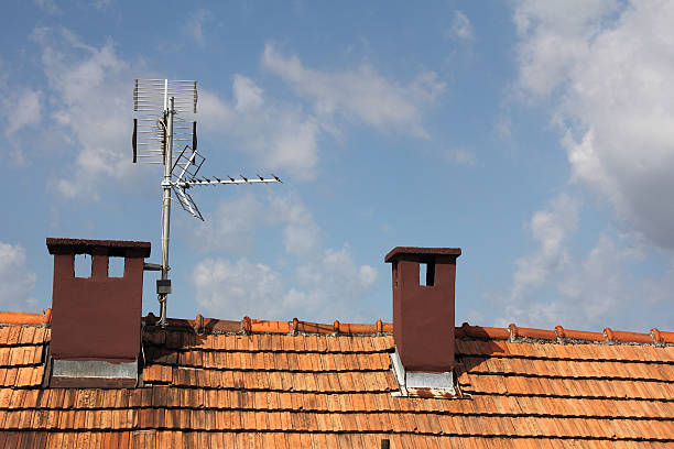 Antenna Antennas  to receive TV signals on the roof parabol stock pictures, royalty-free photos & images