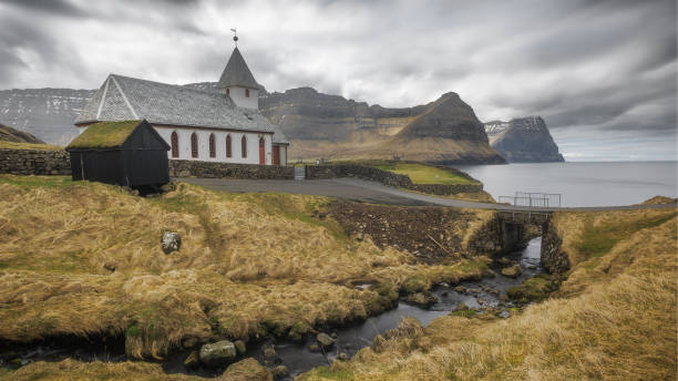 istock Lakeside Retreat: A Tranquil House Nestled by the Water's Edge 1856478319