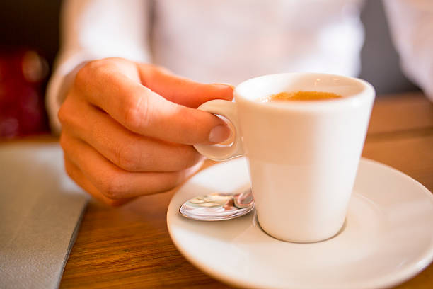 istock Woman drinking espresso in cafe 185648162