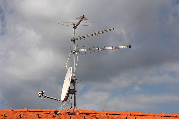 TV antenna Antennas  to receive TV signals on the roof parabol stock pictures, royalty-free photos & images