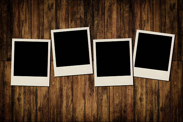 istock Blank instant photo frames on old wooden background 185648741