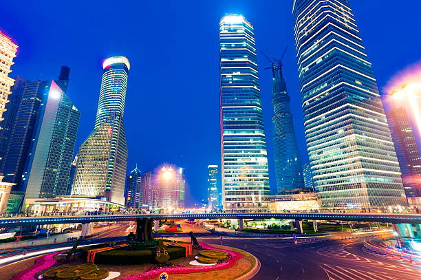 istock shanghai downtown at night with roundabout light trails 185649130