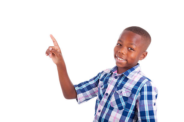 istock Happy faced boy in blue plaid shirt pointing at the ceiling 185649322