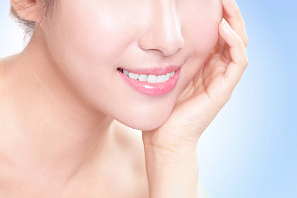 istock Beautiful young woman teeth close up 185649341