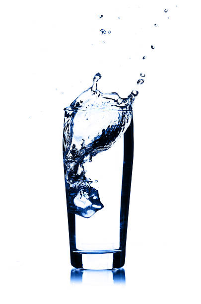 istock water splash in glass isolated on white background 185654352