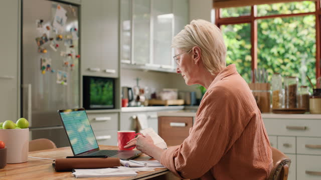 Mature, woman and laptop for financial planning in home with bills, receipts and webpage for bank statement. Female person, reading and technology for savings, budget or investment for retirement