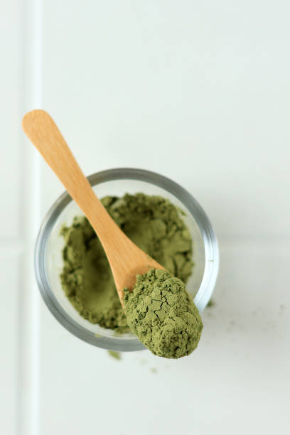 istock Green Matcha Tea Powder with Spoon 1856576318