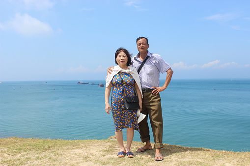 A family in their traveling to Danang, Vietnam. This is a famous city with a lot of nice beach.