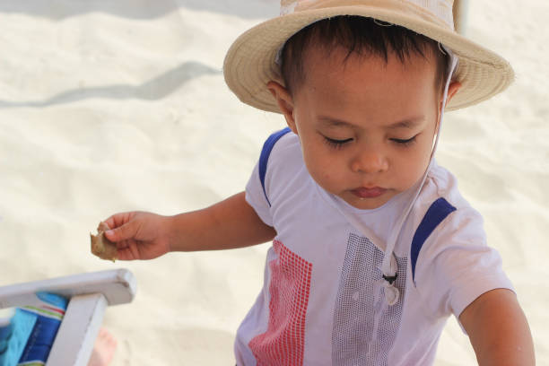 The kid in his traveling to Danang, Vietnam. This is a famous city with a lot of nice beach.
