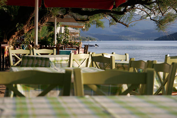 istock Cafe tables near the sea, focus on tables 185659078