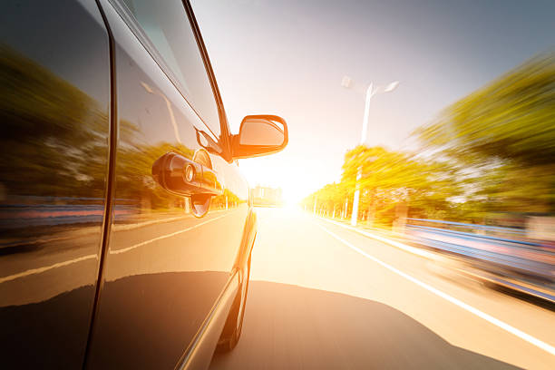 istock car driving on a motorway at high speeds 185660074