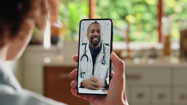 Video call, smartphone screen and doctor talking to patient for healthcare support, virtual advice and telehealth service. African expert on mobile, medical questions and online consultation at home