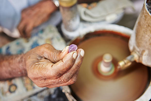 Moonstone Craftsman is showing moonstone. It is one of the gems found in Sri Lanka. - Selective focus jewelry craftsperson craft jeweller stock pictures, royalty-free photos & images