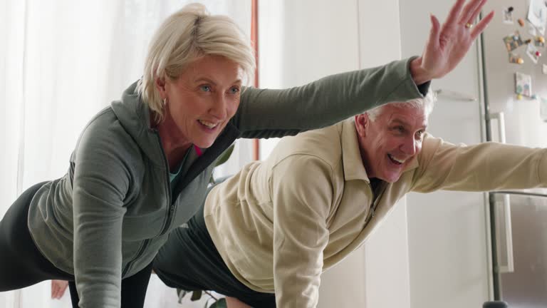 Senior fitness, stretching and old couple on a floor for yoga, exercise or bonding in their home together. Wellness, retirement and elderly people in house with balance, support or fun stress relief