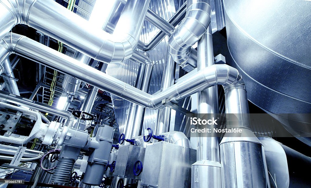 Equipment, cables and piping Equipment, cables and piping as found inside of a modern industrial power plant. Industry Stock Photo