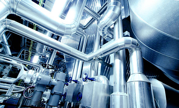 Equipment, cables and piping Equipment, cables and piping as found inside of a modern industrial power plant. piping hot stock pictures, royalty-free photos & images