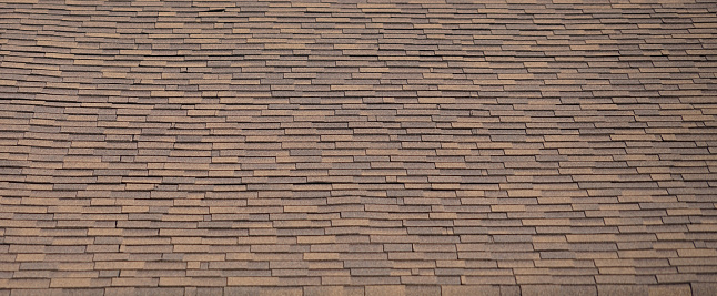 Wood shingles on the roof of an old German barn.