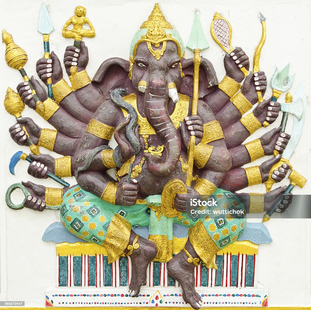 Hindu God Ganesha avatar image in stucco color paint God of success 4 of 32 posture. Indian style or Hindu God Ganesha avatar image in stucco low relief technique with vivid color,Wat Samarn, Chachoengsao,Thailand. Animal Stock Photo