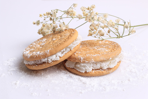 Biscuits filled with Turkish delights on white.